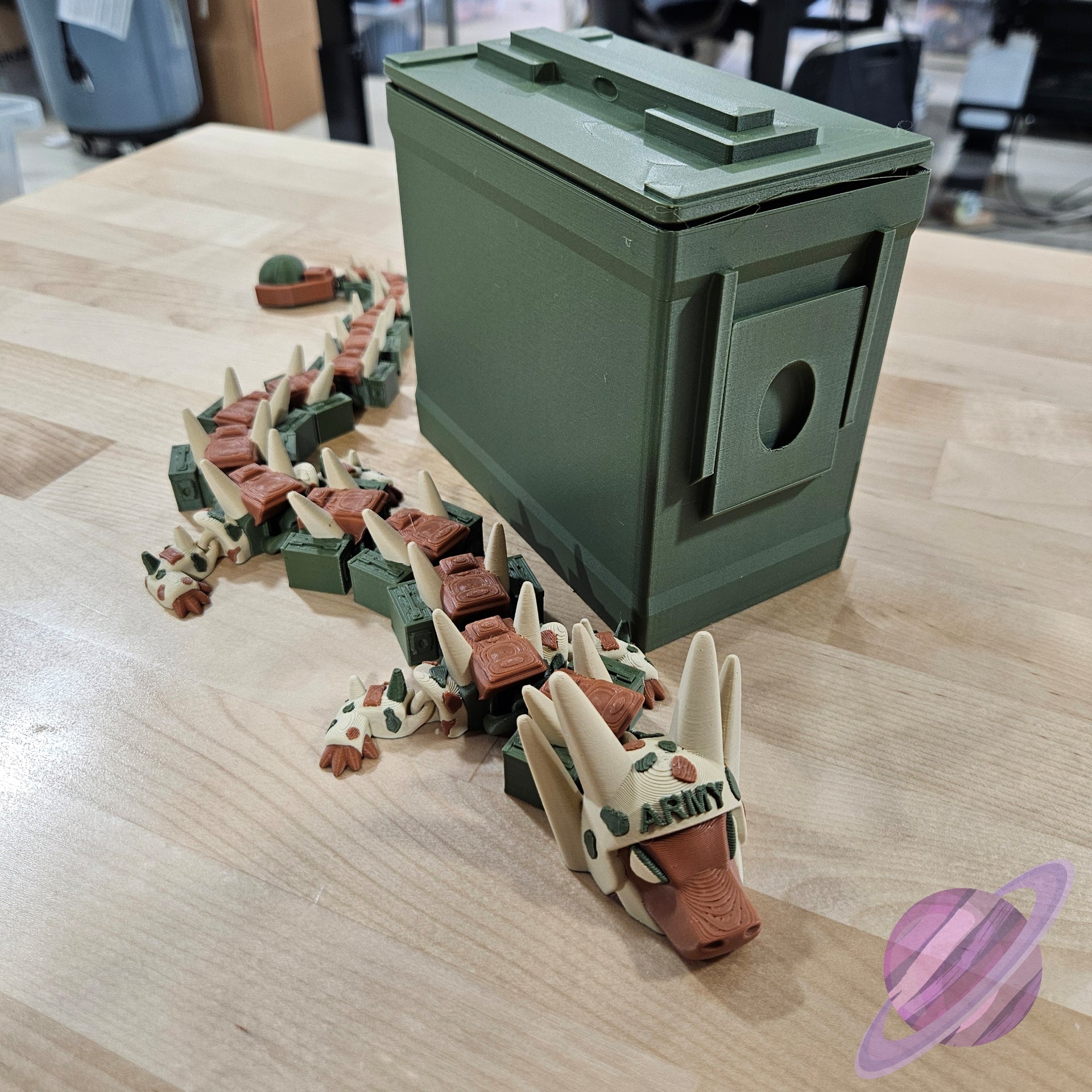 Toy dinosaur set with a green box on a wooden surface