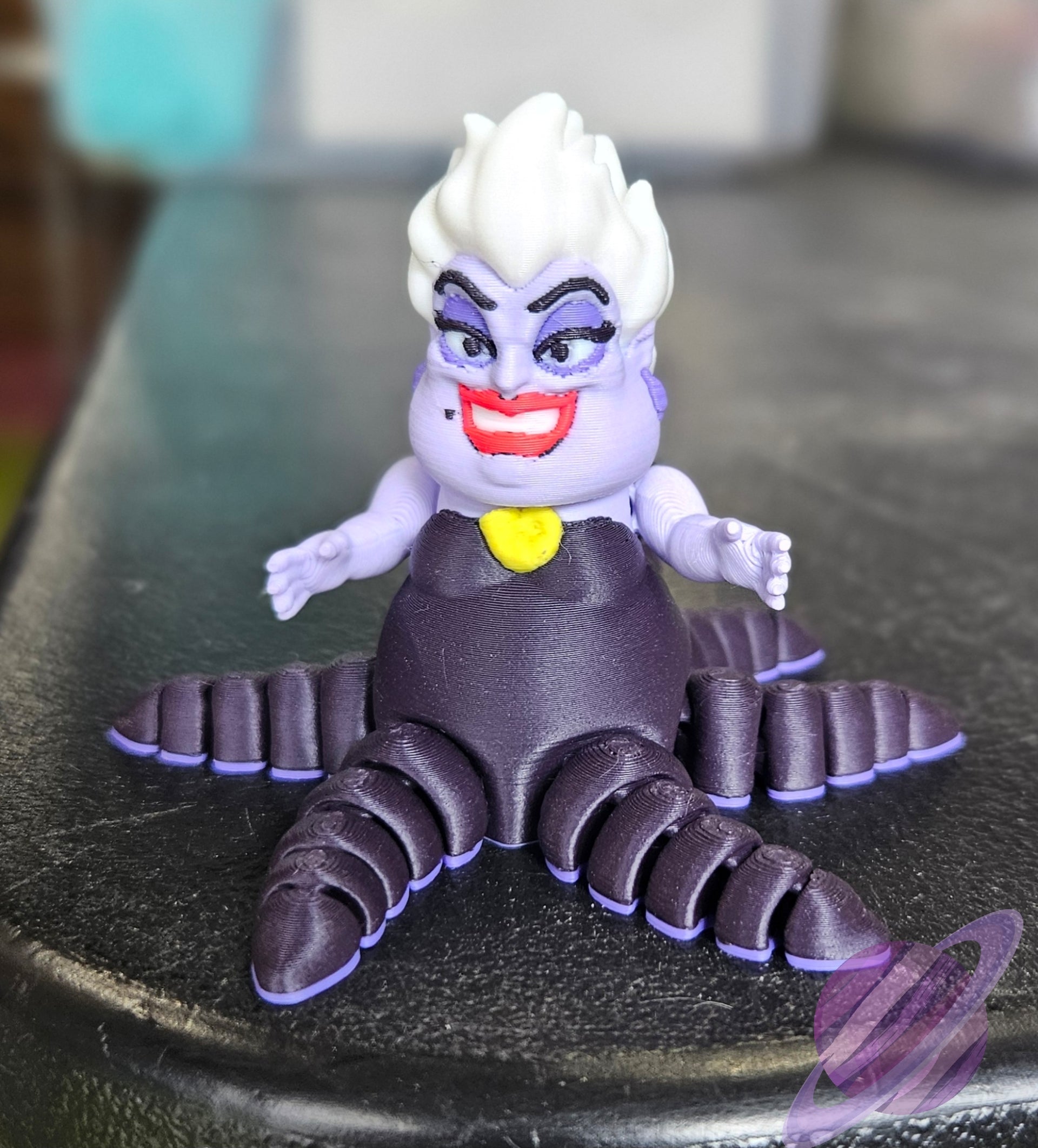 Toy figure of a character with purple hair and a yellow shirt on a black surface