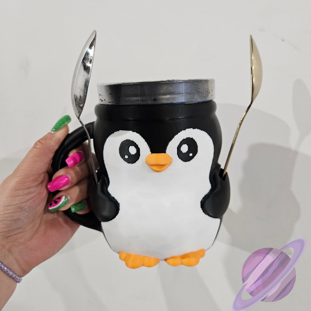 Penguin-shaped mug with a hand holding it against a plain background