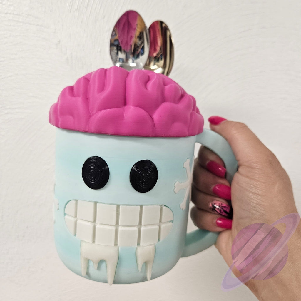 Person holding a novelty mug with a brain design and pink lid.