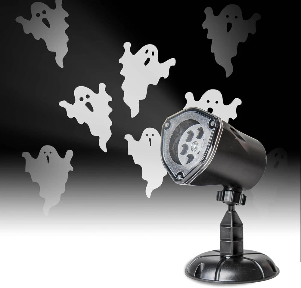 Halloween projector with ghost silhouettes on a black background