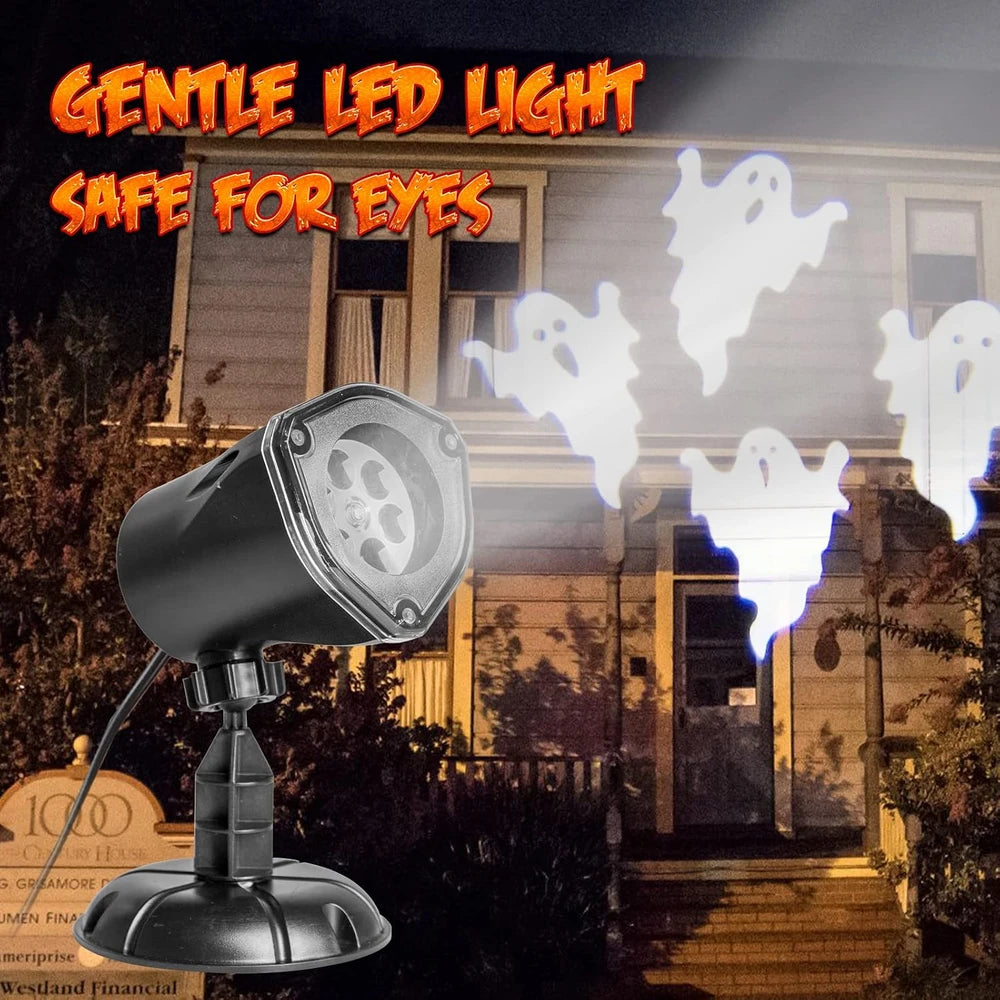 A black LED ghost projector light shown in the foreground with glowing white ghost projections on a house facade at night. Large orange text at the top reads 'GENTLE LED LIGHT SAFE FOR EYES'.