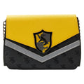 Yellow and black handbag with a crest design on a white background