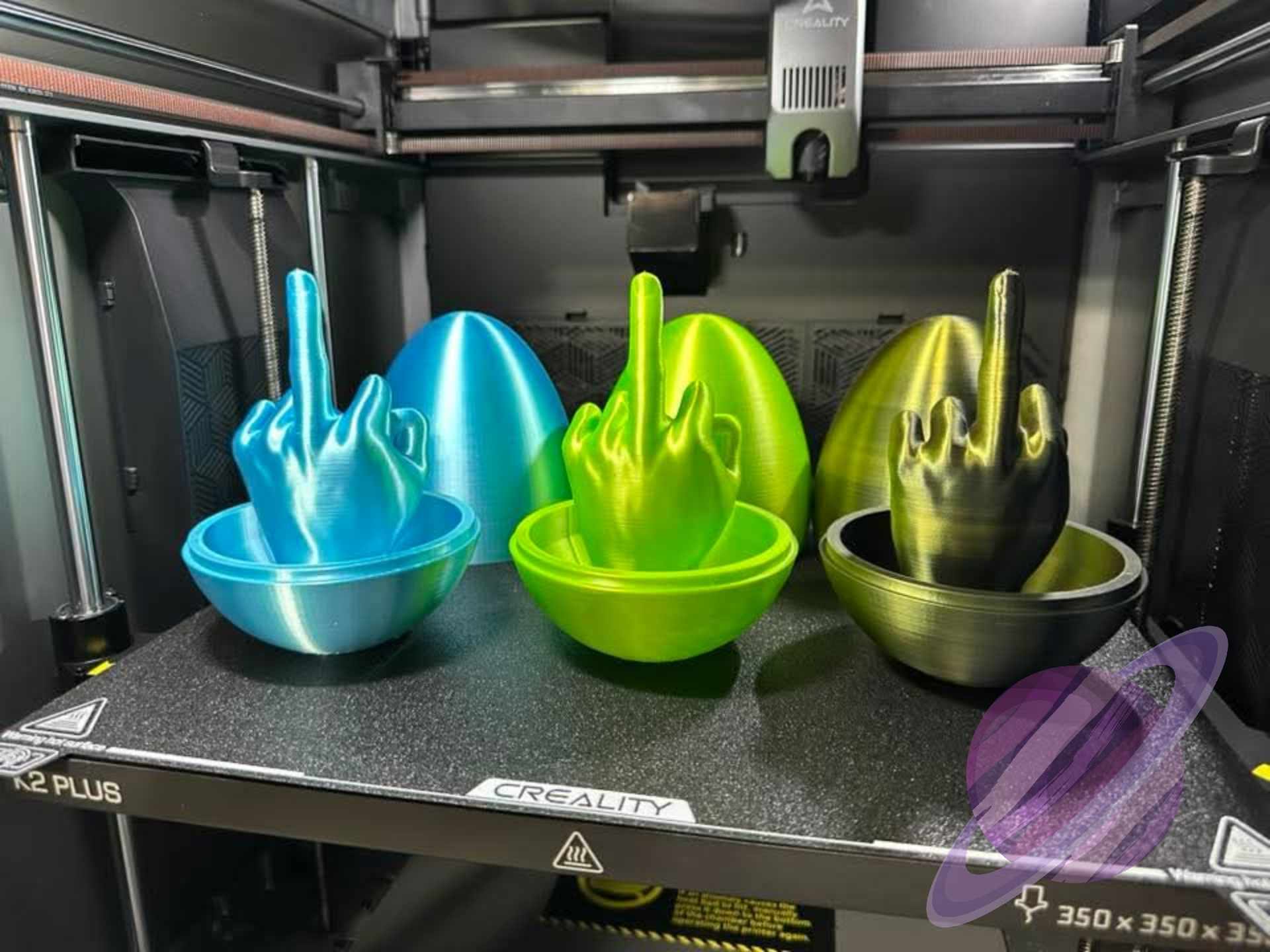 Colorful 3D-printed objects on a Creality 3D printer bed