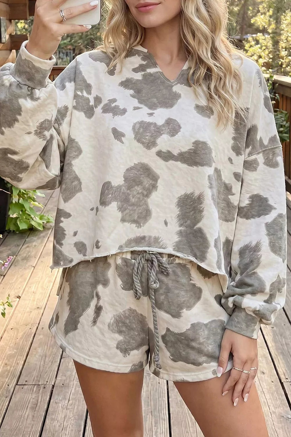 grey cowprint casual outfit featuring long sleeve top and drawstring waist shorts. Perfect for lounging around or running errands.