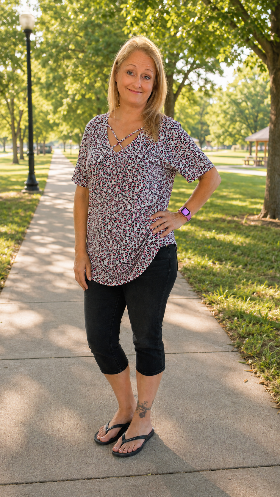 SHORT SLEEVE CRISS-CROSS VNECK ANIMAL PRINT BABYDOLL TOP TOP