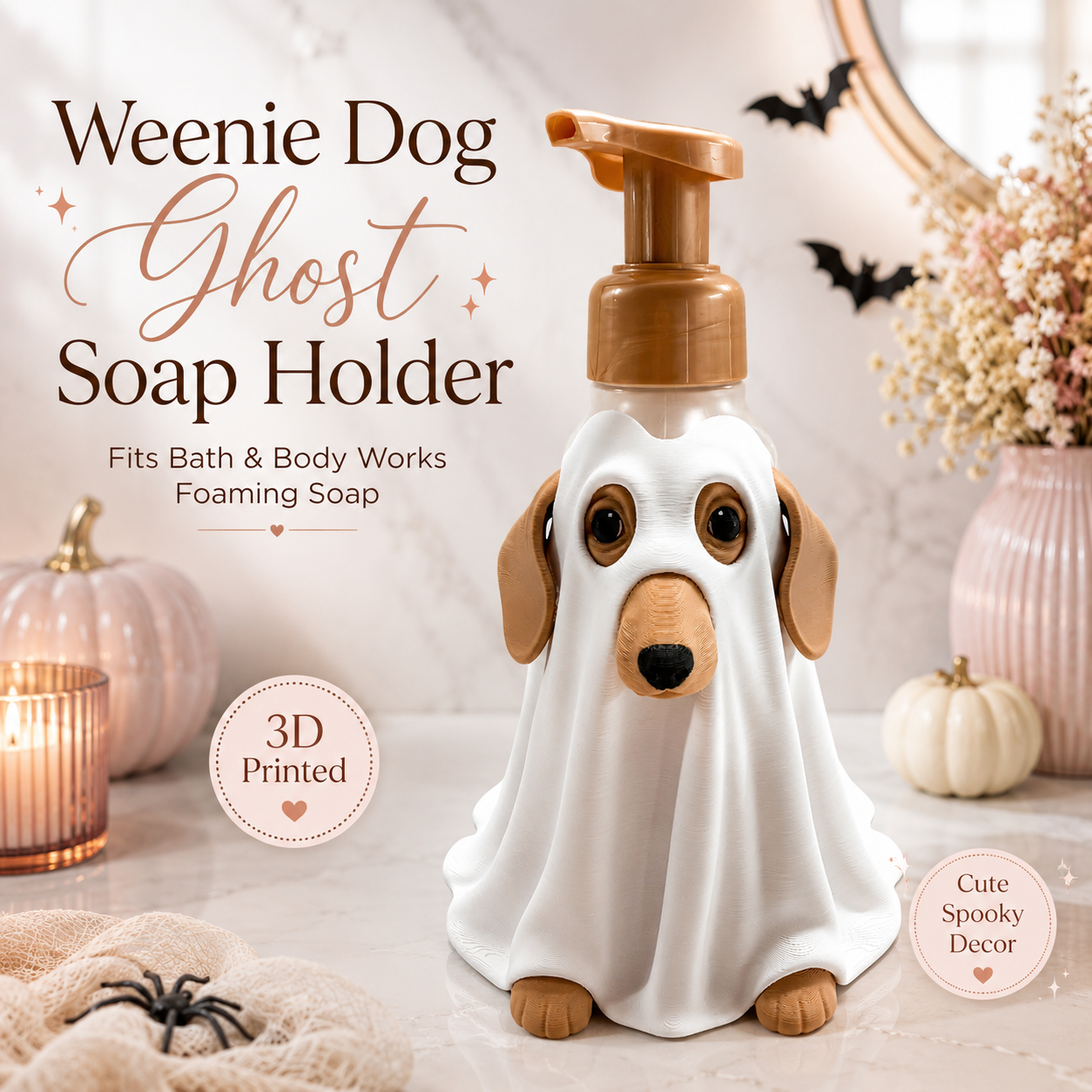 A novelty foaming soap dispenser shaped like a dachshund dressed as a ghost, with a white sheet-like body, brown ears and paws, and a brown pump top. The product is displayed on a marble surface with Halloween decorations including pumpkins, a spider, a candle, and bats, with text overlays describing the product.