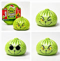 A four-panel product collage showing a Grinch-themed squishy toy. The top-left panel shows the packaged toy and its retail box on a white background.