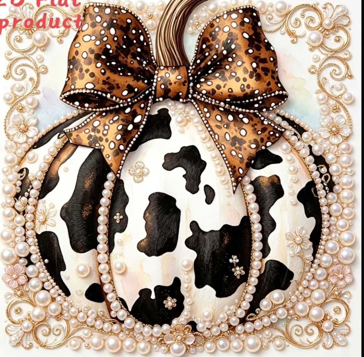 A decorative pumpkin-shaped ornament with a black-and-white cow print body, a large brown leopard-print bow with white dot accents, and a border of faux pearls and ornate gold scrollwork on a light background.