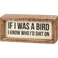 Wooden sign with humorous text 'If I was a bird, I know who I'd shit on' on a white background