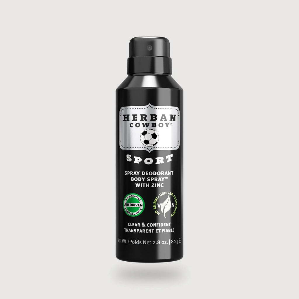 Herban Cowboy Sport spray deodorant bottle on a light gray background