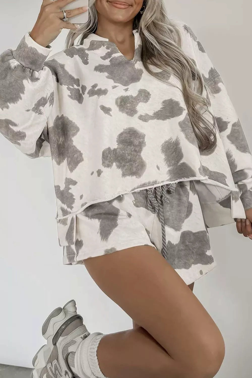 grey cowprint casual outfit featuring long sleeve top and drawstring waist shorts. Perfect for lounging around or running errands.