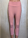 Light pink leggings, capris, and biker shorts with pockets