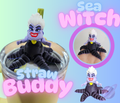 Sea Witch straw buddy toy with a glass of juice on a colorful background